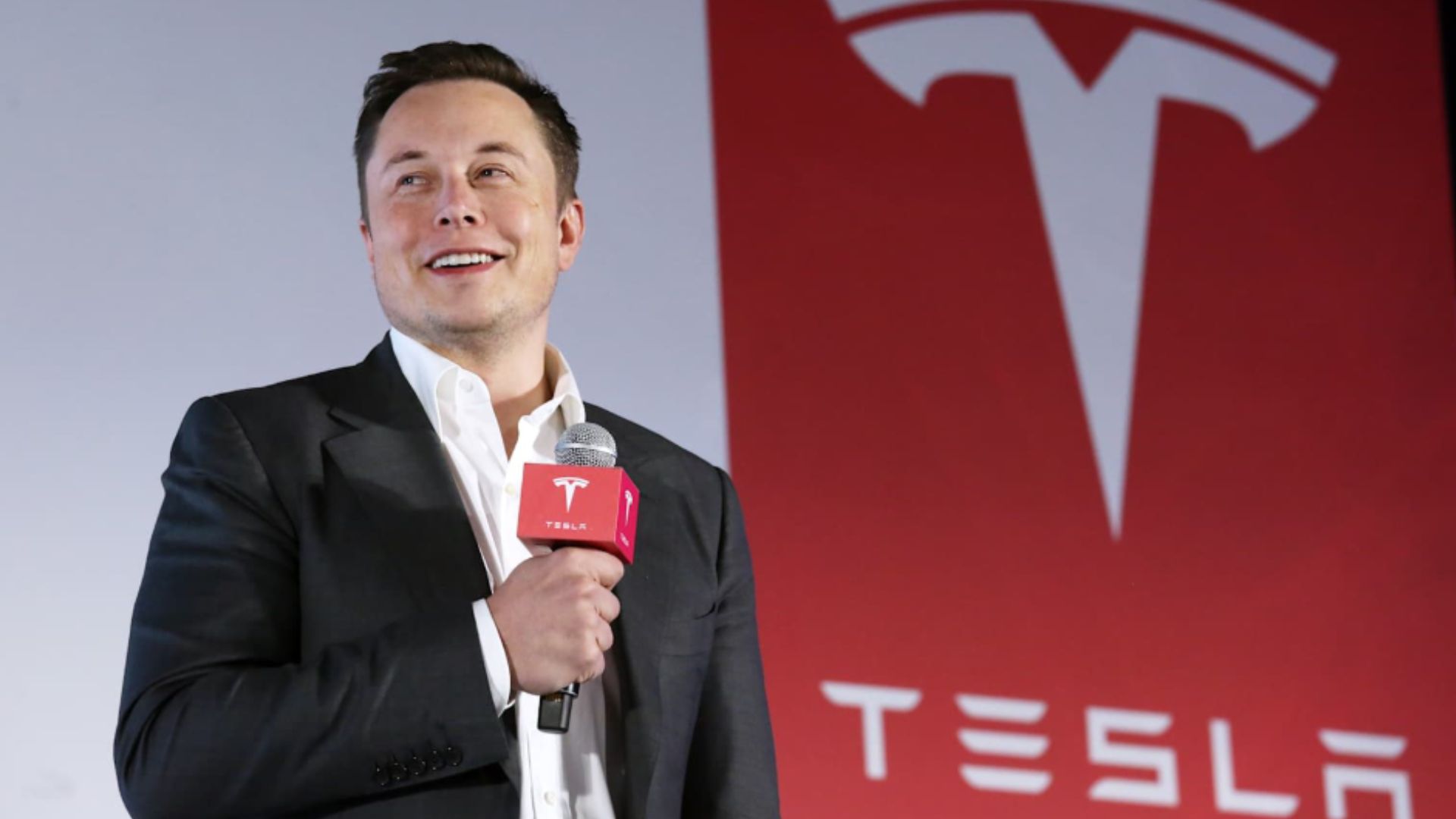Tesla Motors CEO Elon Musk speaks to the media next to its Model S during a press conference in Hong Kong. 25JAN16 SCMP/ Nora Tam (Photo by Nora Tam/South China Morning Post via Getty Images)